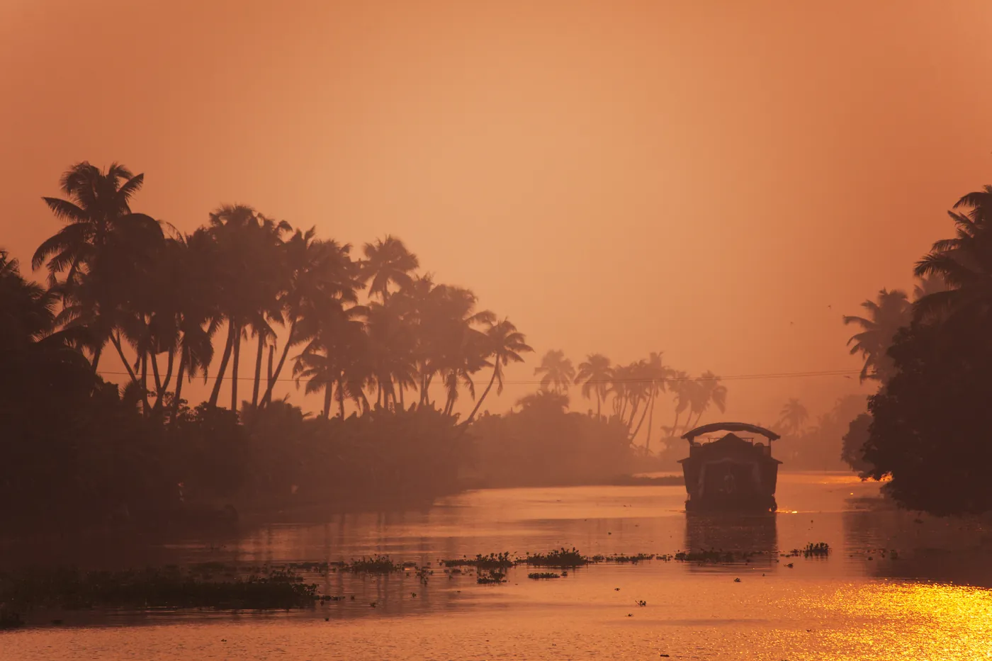 Houseboat on the backwater at dusk