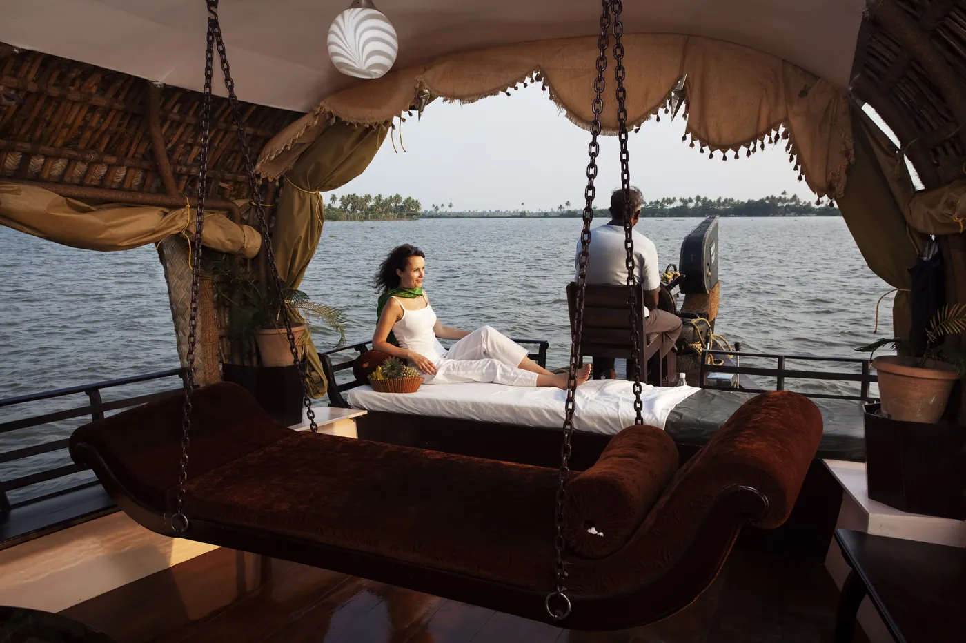 A couple relaxing on a private houseboat